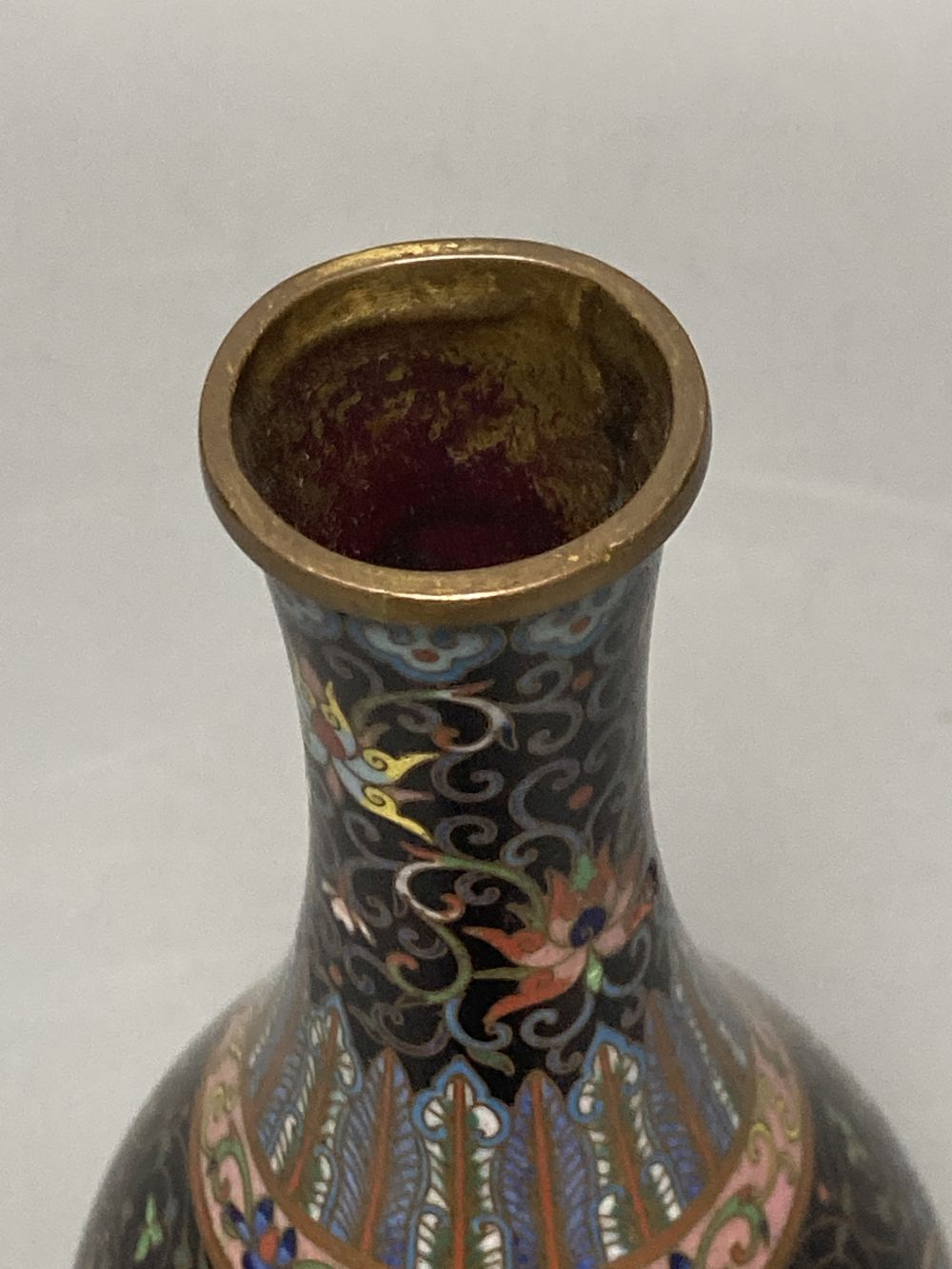 A Chinese powder blue ground vase and a similar cloisonne bottle vase, height 15cm